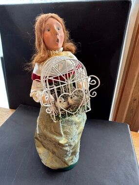Decorative Ceramic Doll with White Birdcage Accent